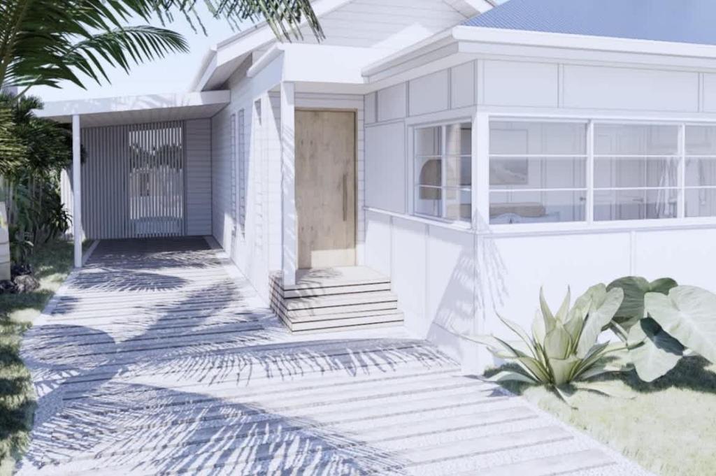 a white house with a front door and palm trees at The Cottage at Pearl Beach in Pearl Beach