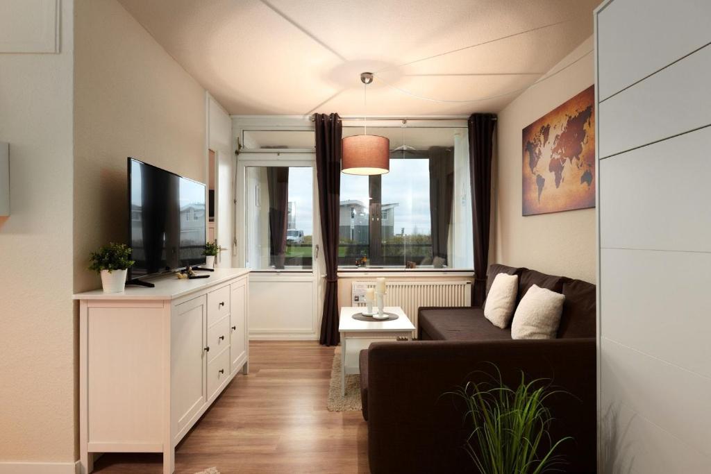 TV a/nebo společenská místnost v ubytování Marina Wendtorf Heimathafen