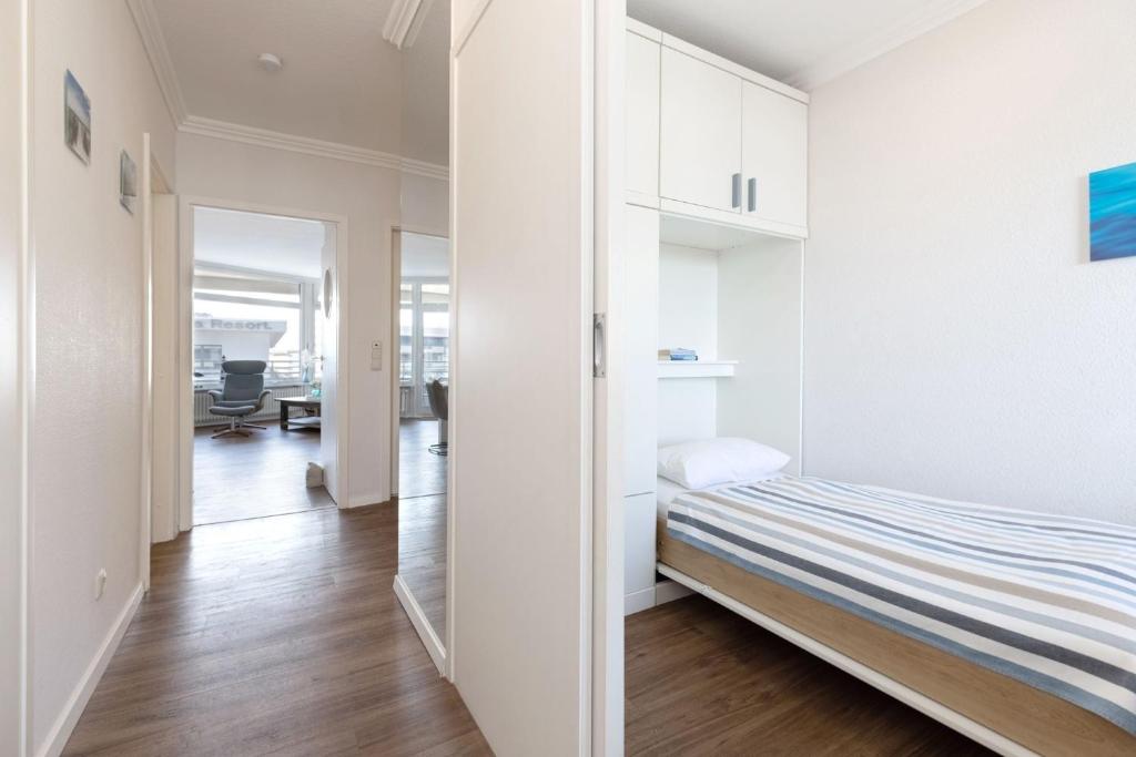 Postel nebo postele na pokoji v ubytování Grömitz Center Wohnung 763