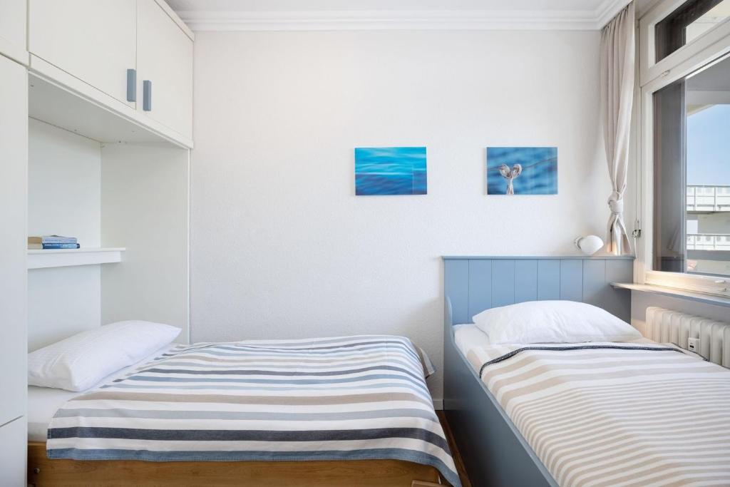 Postel nebo postele na pokoji v ubytování Grömitz Center Wohnung 763