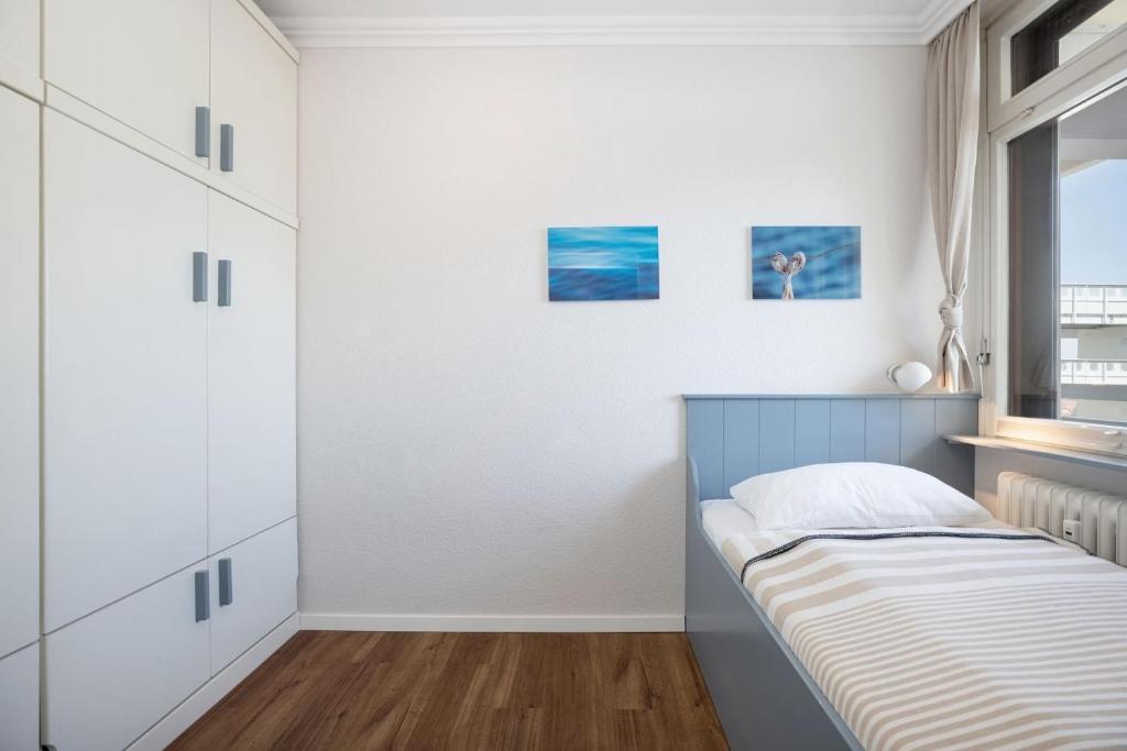 Postel nebo postele na pokoji v ubytování Grömitz Center Wohnung 763