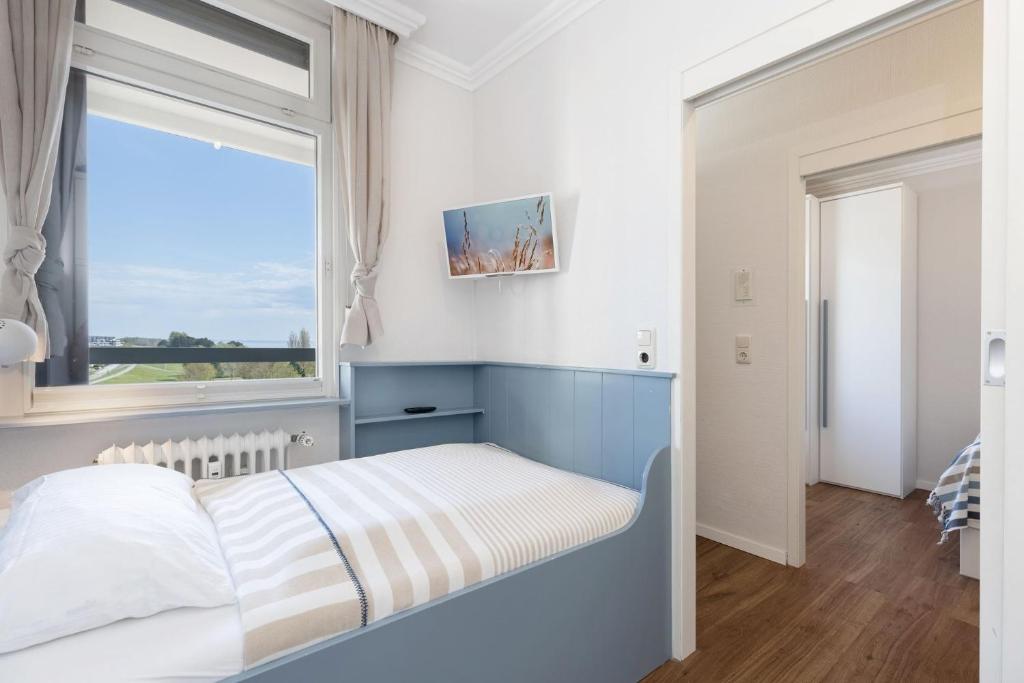 Postel nebo postele na pokoji v ubytování Grömitz Center Wohnung 763