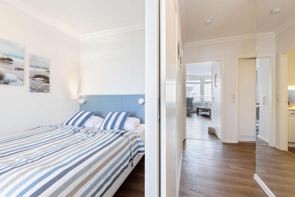Postel nebo postele na pokoji v ubytování Grömitz Center Wohnung 763