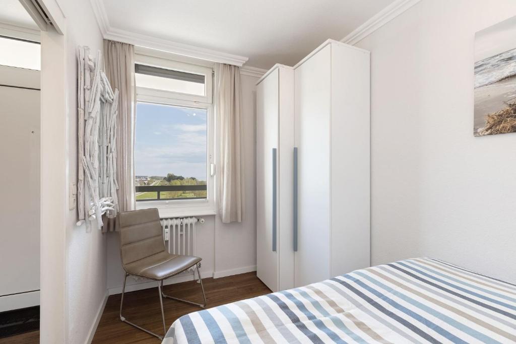 Postel nebo postele na pokoji v ubytování Grömitz Center Wohnung 763
