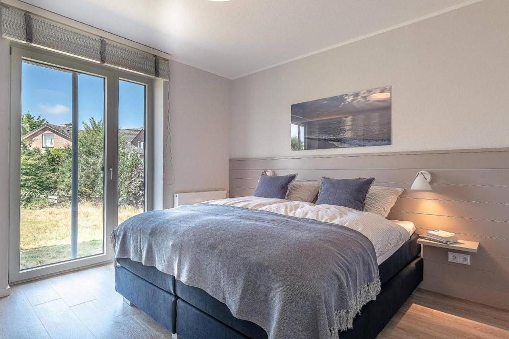 Postel nebo postele na pokoji v ubytování Sonne und Meer Wohnung 1