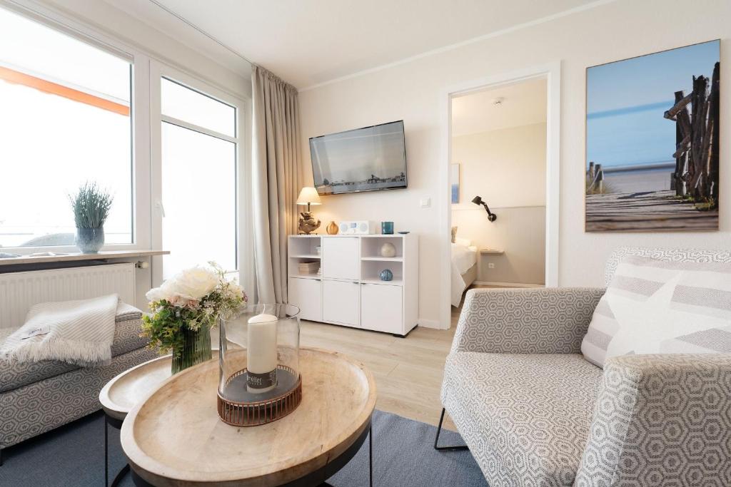 TV a/nebo společenská místnost v ubytování Strandschloss Horizont