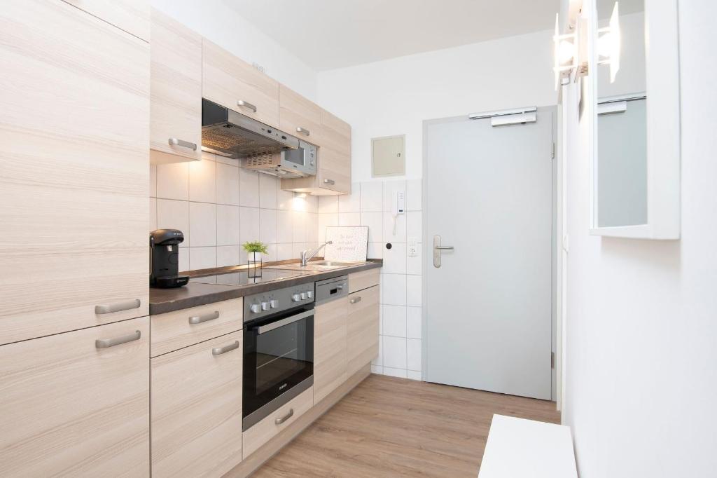 Kuchyň nebo kuchyňský kout v ubytování Haus Seebad Lieblingsplatz Grömitz