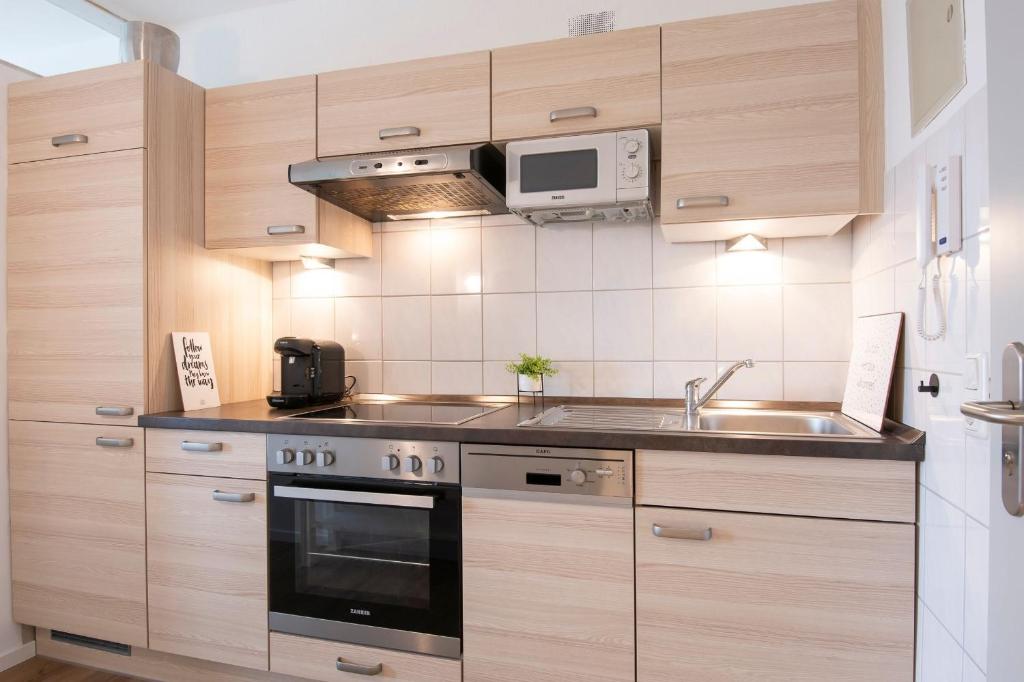 Kuchyň nebo kuchyňský kout v ubytování Haus Seebad Lieblingsplatz Grömitz