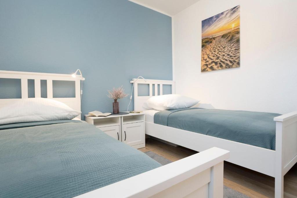 Postel nebo postele na pokoji v ubytování Lütt Kajüt