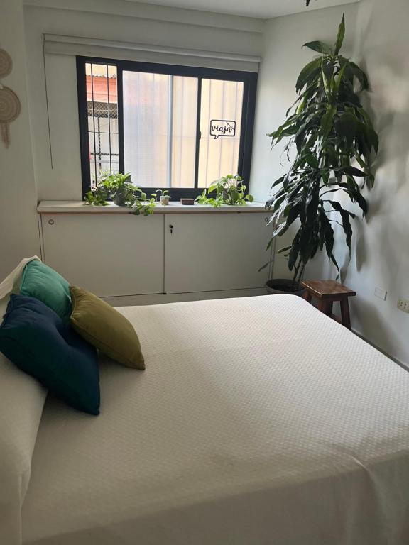 Ένα ή περισσότερα κρεβάτια σε δωμάτιο στο Crisostomo departamento