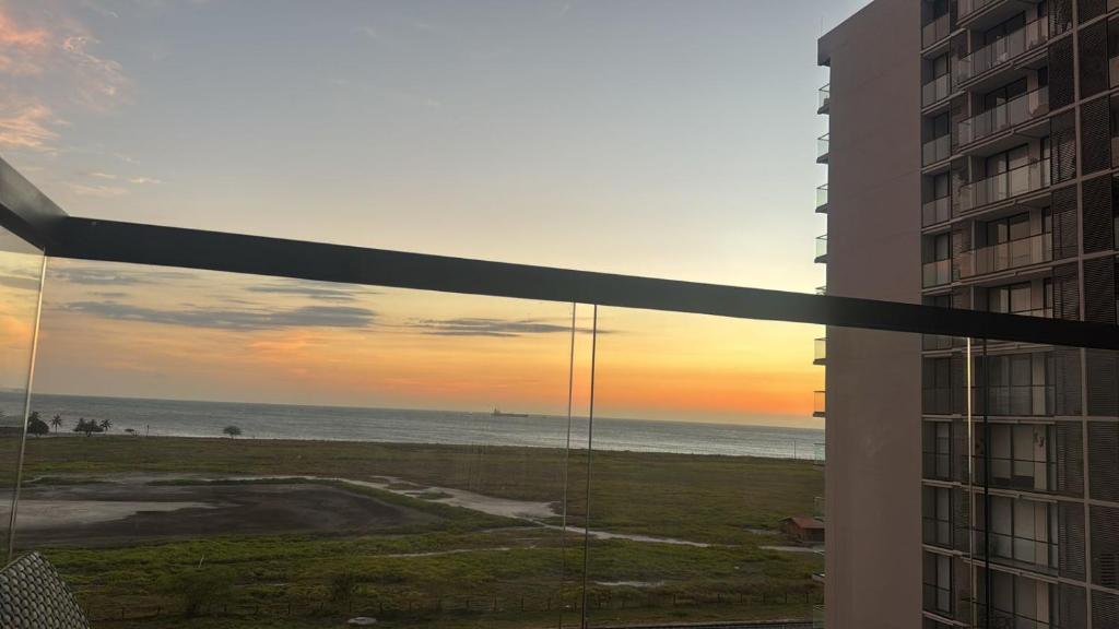 a view of the beach from a balcony of a building at Espectacular Apartamento en Santa Marta in Playa Bello Horizonte