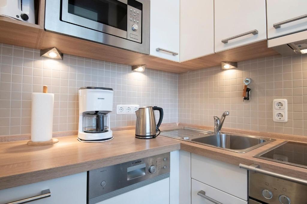 Kuchyň nebo kuchyňský kout v ubytování Grömitz Center Ostseeflair