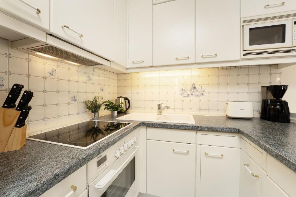 Kuchyň nebo kuchyňský kout v ubytování Grömitz Center Wohnung 759