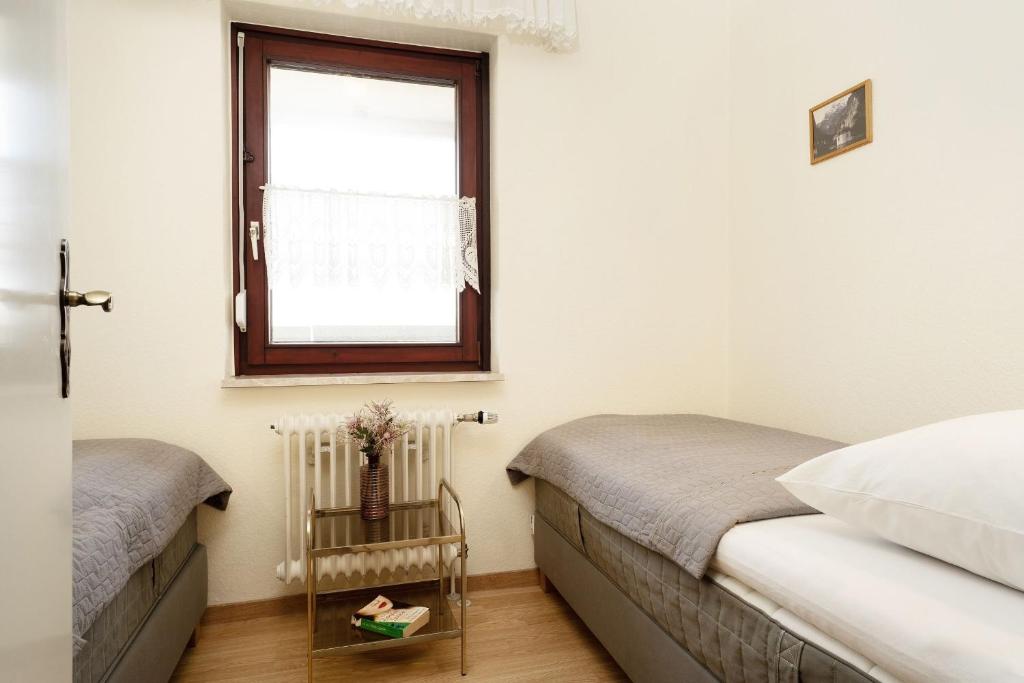 Postel nebo postele na pokoji v ubytování Grömitz Center Wohnung 759