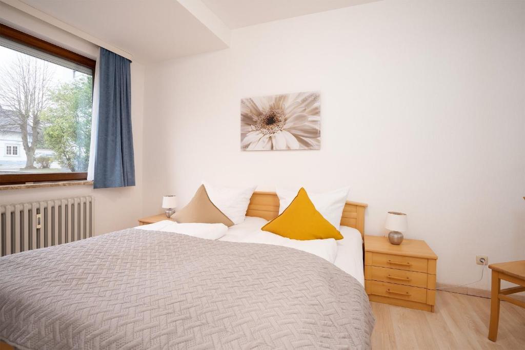 Postel nebo postele na pokoji v ubytování Haus Seebrise- Wohnung 7