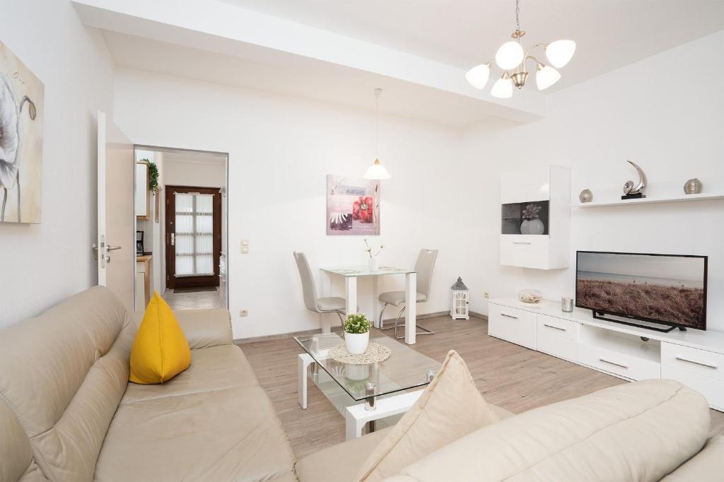TV a/nebo společenská místnost v ubytování Haus Seebrise- Wohnung 7