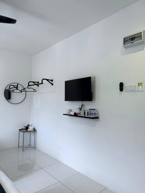 TV a/nebo společenská místnost v ubytování TDOZE Hotel