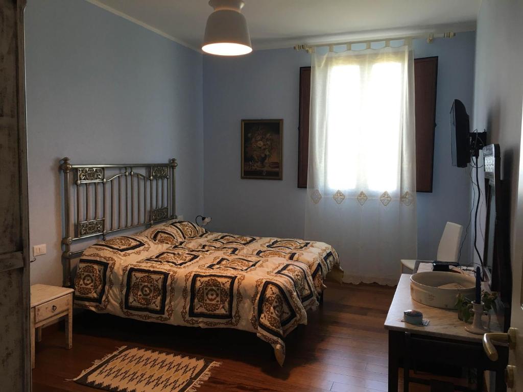 Postel nebo postele na pokoji v ubytování Baglio Buccellato