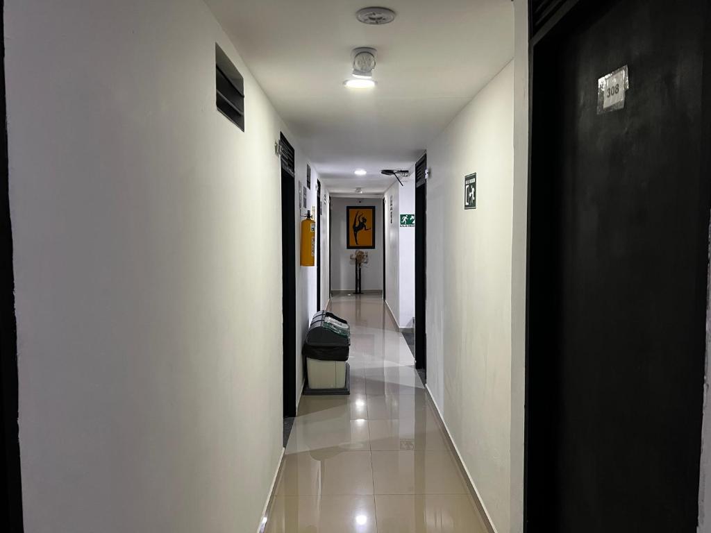 Postel nebo postele na pokoji v ubytování Hotel Laureles Aburrá