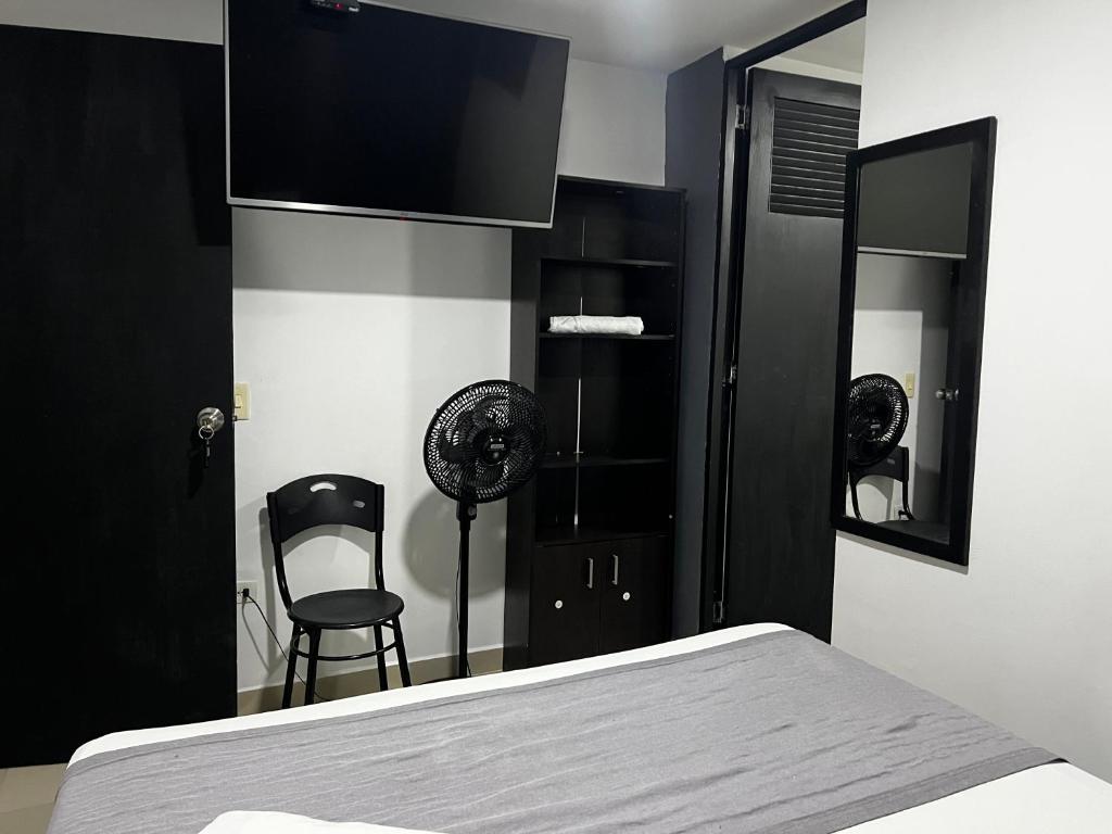 Postel nebo postele na pokoji v ubytování Hotel Laureles Aburrá