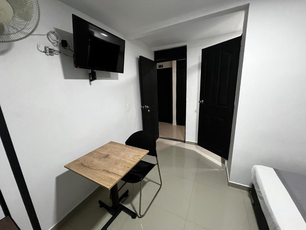 TV a/nebo společenská místnost v ubytování Hotel Laureles Aburrá