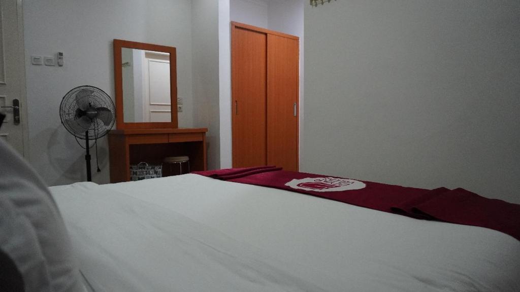 Postel nebo postele na pokoji v ubytování Diyar Villas Puncak K3/2