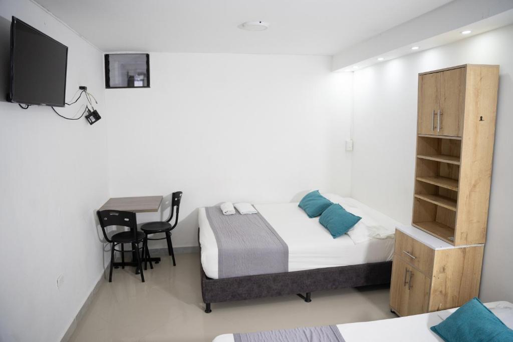 TV a/nebo společenská místnost v ubytování Hotel Laureles Aburrá