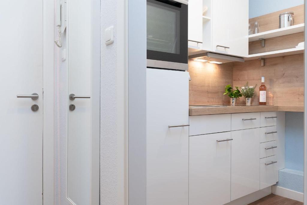 Kuchyň nebo kuchyňský kout v ubytování Solymar Wohnung 22