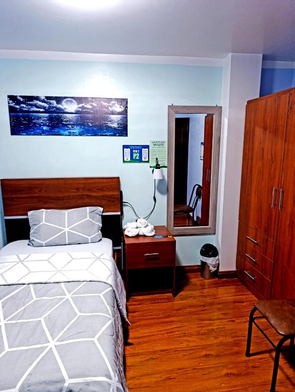 Postel nebo postele na pokoji v ubytování Hostal Valle Andino