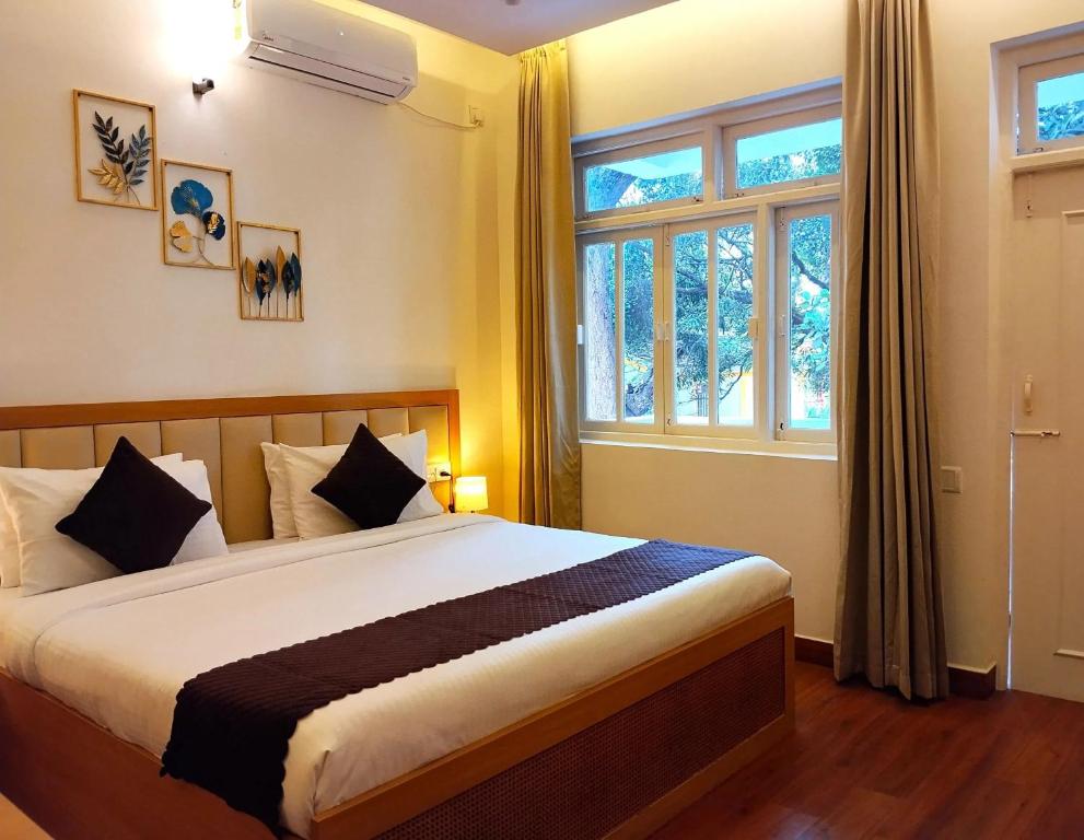 Postel nebo postele na pokoji v ubytování Maashpi Hotel & Resort, Candolim