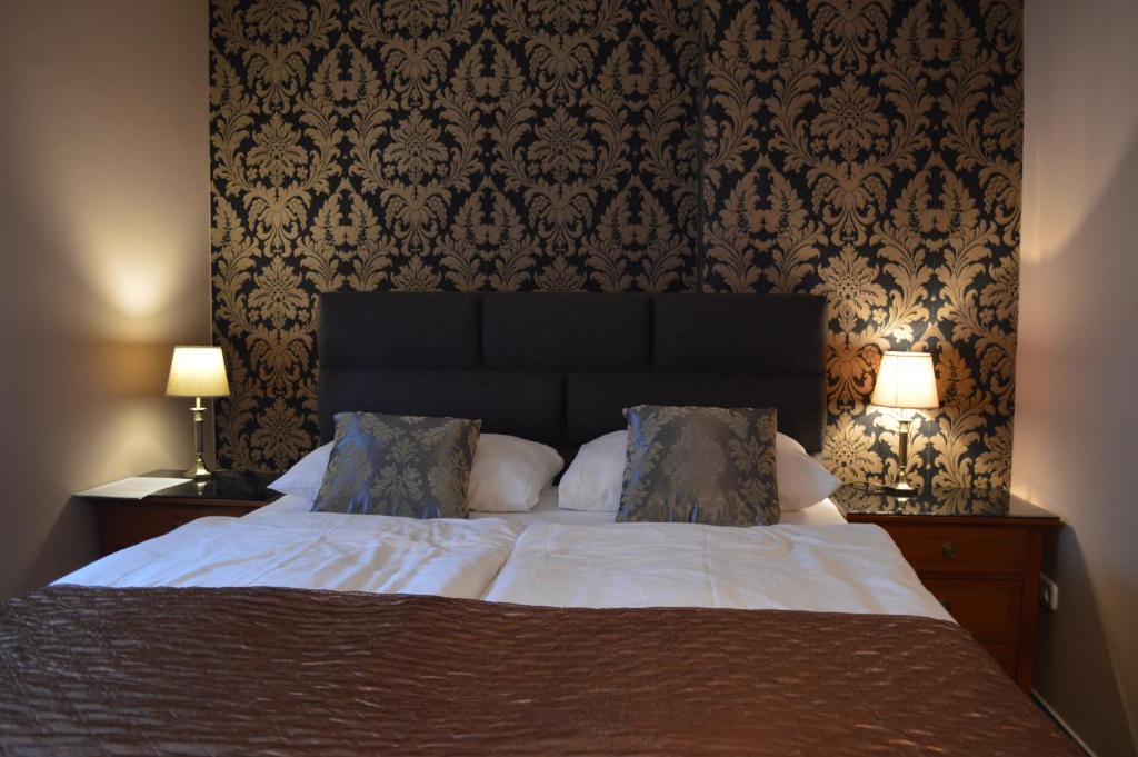Postel nebo postele na pokoji v ubytování Platán Hotel