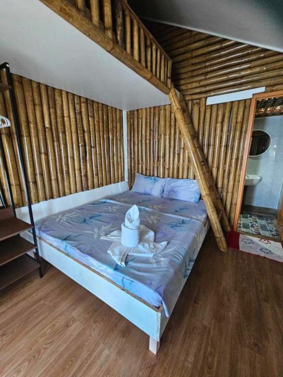 Postel nebo postele na pokoji v ubytování Tambayan Rooms and Cottages by SMS Hospitality