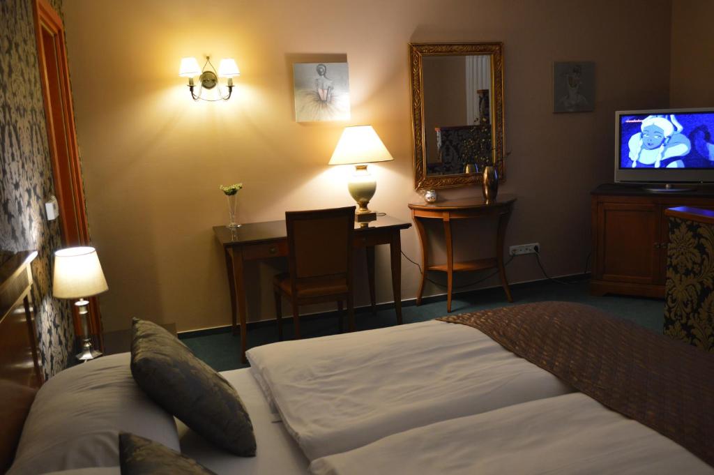Postel nebo postele na pokoji v ubytování Platán Hotel