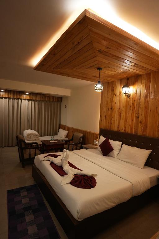Letto o letti in una camera di Hotel Monal