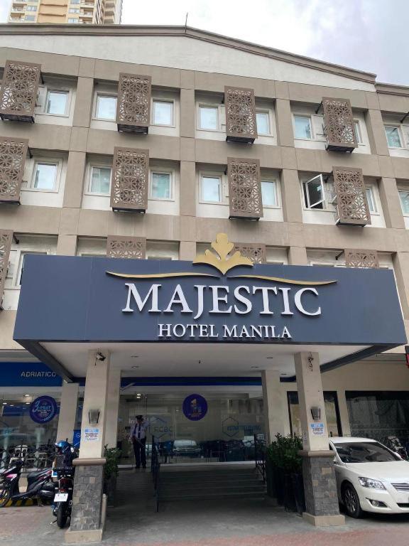 a large building with a sign for a majestic hotel manilla at Majestic Hotel Manila - Formerly Octagon Mansion Hotel Manila in Manila