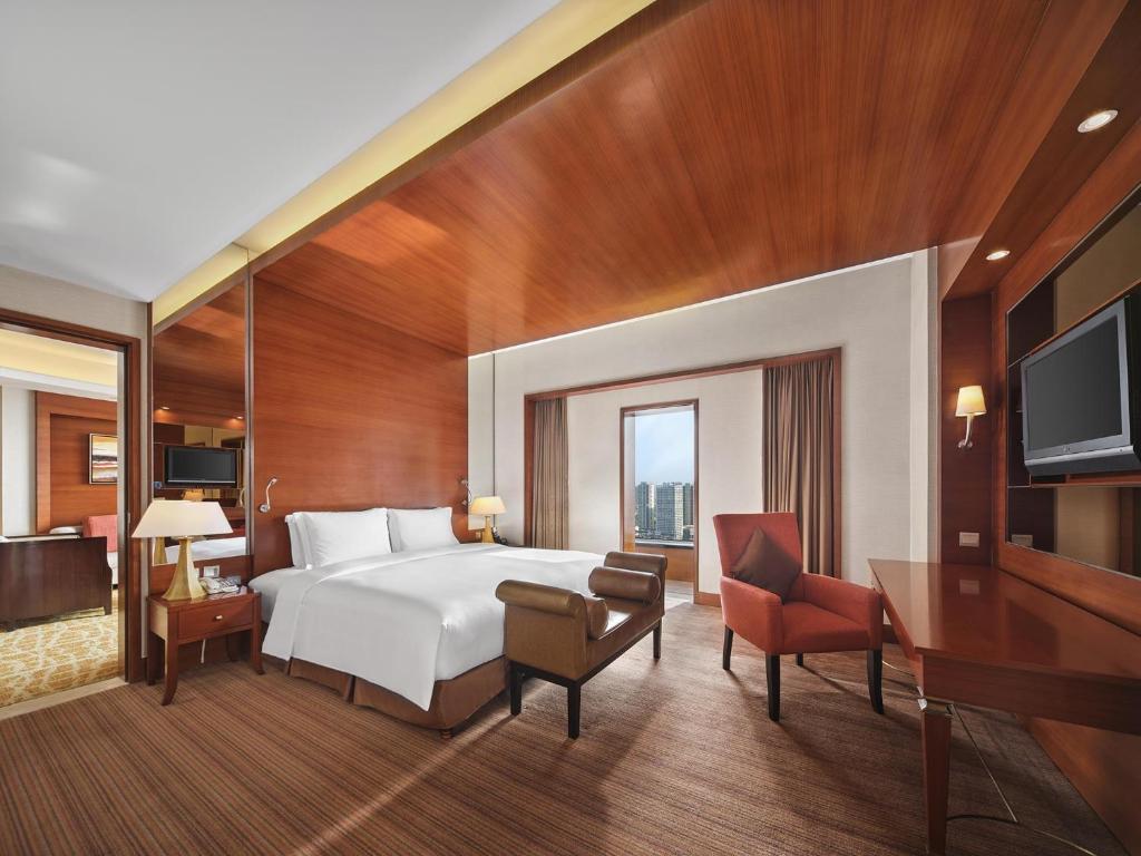 Postel nebo postele na pokoji v ubytování Hilton Hefei