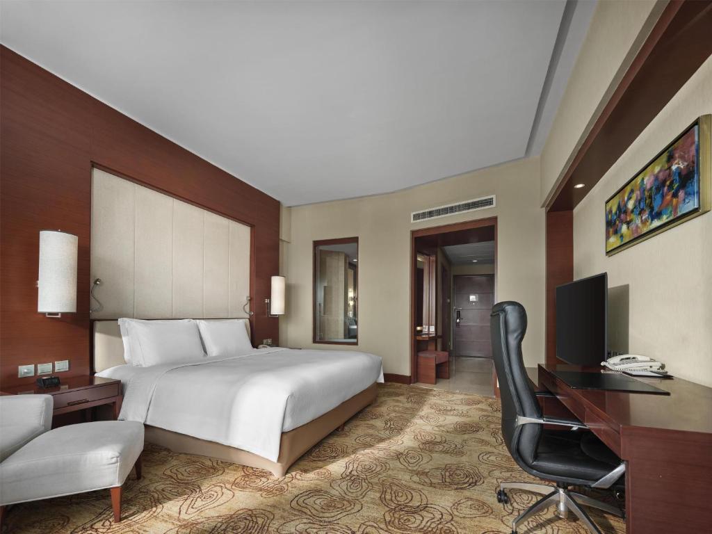 Postel nebo postele na pokoji v ubytování Hilton Hefei