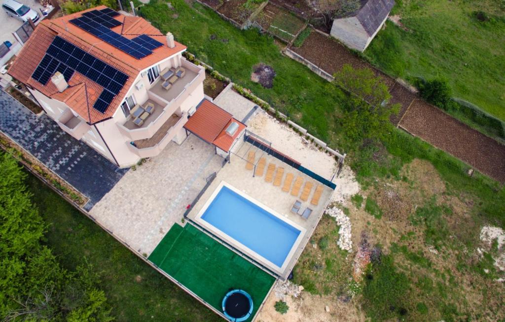 an overhead view of a house with a swimming pool at Villa Marana in Čavoglave