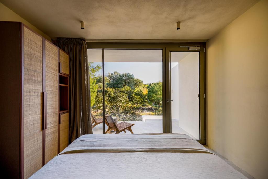Postel nebo postele na pokoji v ubytování Botanico Villa & Suites