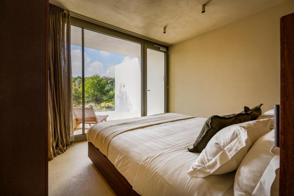 Postel nebo postele na pokoji v ubytování Botanico Villa & Suites