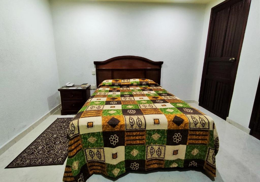 Postel nebo postele na pokoji v ubytování Novotel De Poza Rica