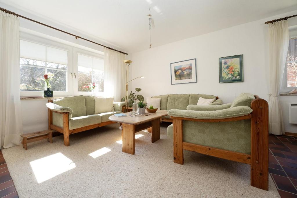 a living room with a couch and a table at Stephan in Petersdorf auf Fehmarn