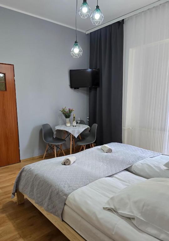 Postel nebo postele na pokoji v ubytování Ośrodek Wypoczynkowy Baśka