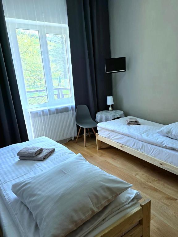 Postel nebo postele na pokoji v ubytování Ośrodek Wypoczynkowy Baśka