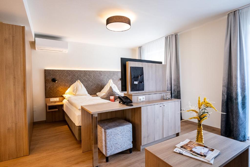 Ένα ή περισσότερα κρεβάτια σε δωμάτιο στο Hotel Rosenvilla