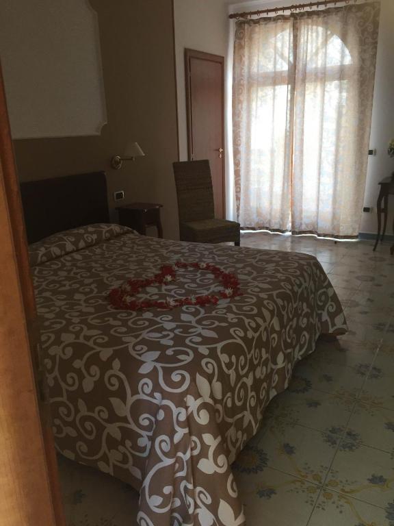 Łóżko lub łóżka w pokoju w obiekcie Villa Giovanna