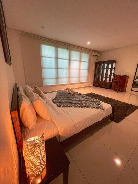 Postel nebo postele na pokoji v ubytování Sembilan Langkawi