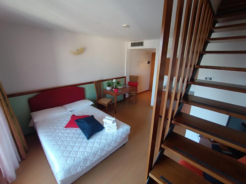 Postel nebo postele na pokoji v ubytování Hotel Il Guscio