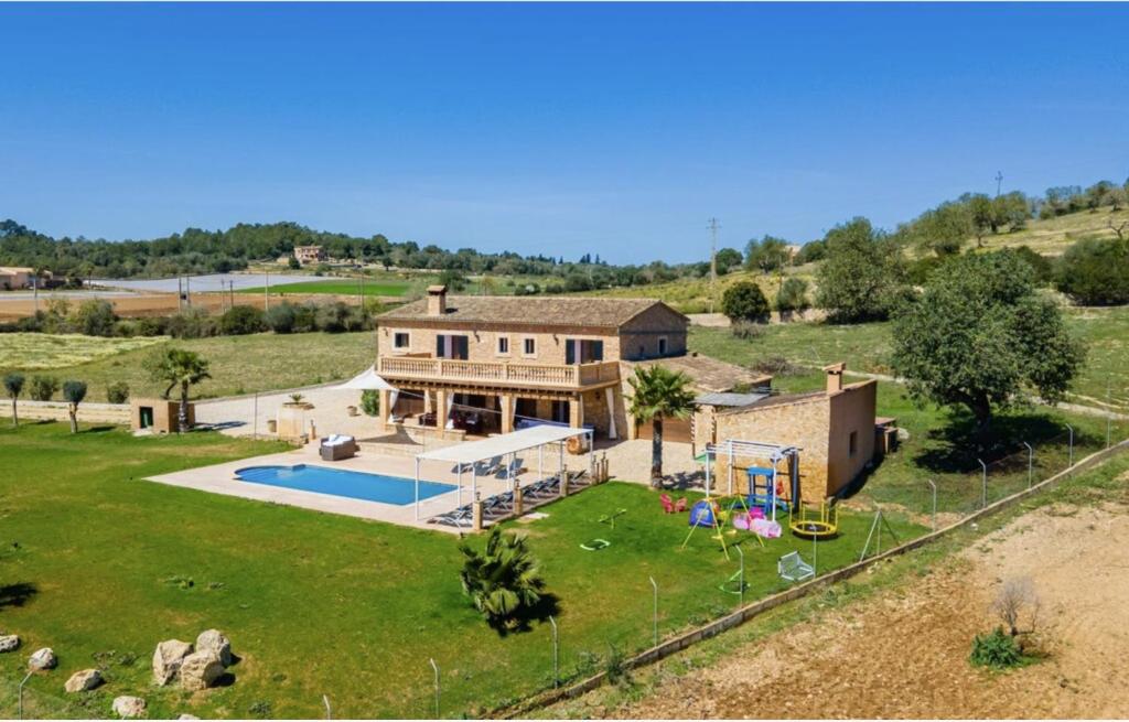 an aerial view of a house with a pool at Villa Lorenzo Manacor by PriorityVillas in Manacor