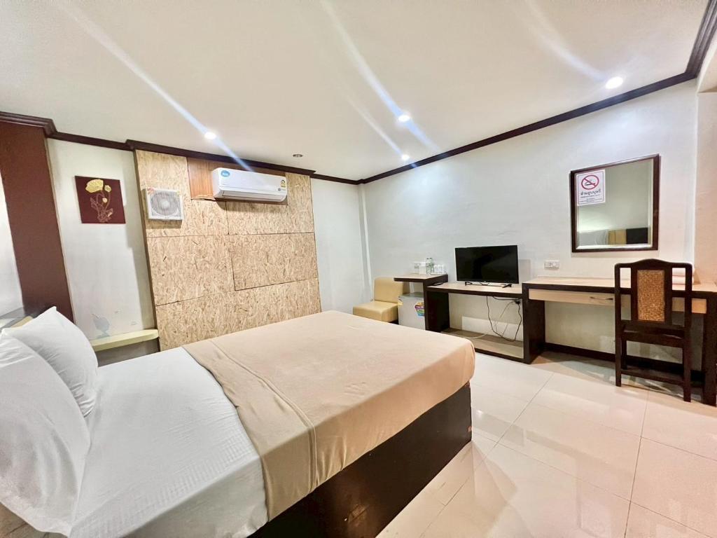Postel nebo postele na pokoji v ubytování Visanuinn Hotel